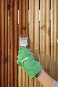 Choosing to stain your fence instead of painting it is your best option, as it lasts longer and requires less maintenance. 